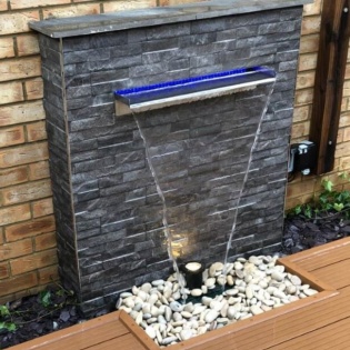 Rok Black Porcelain Walling Cladding On A Water Feature