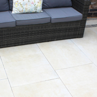 Traverta Classic Cream shown with Natural Paving Pewter Cobbles